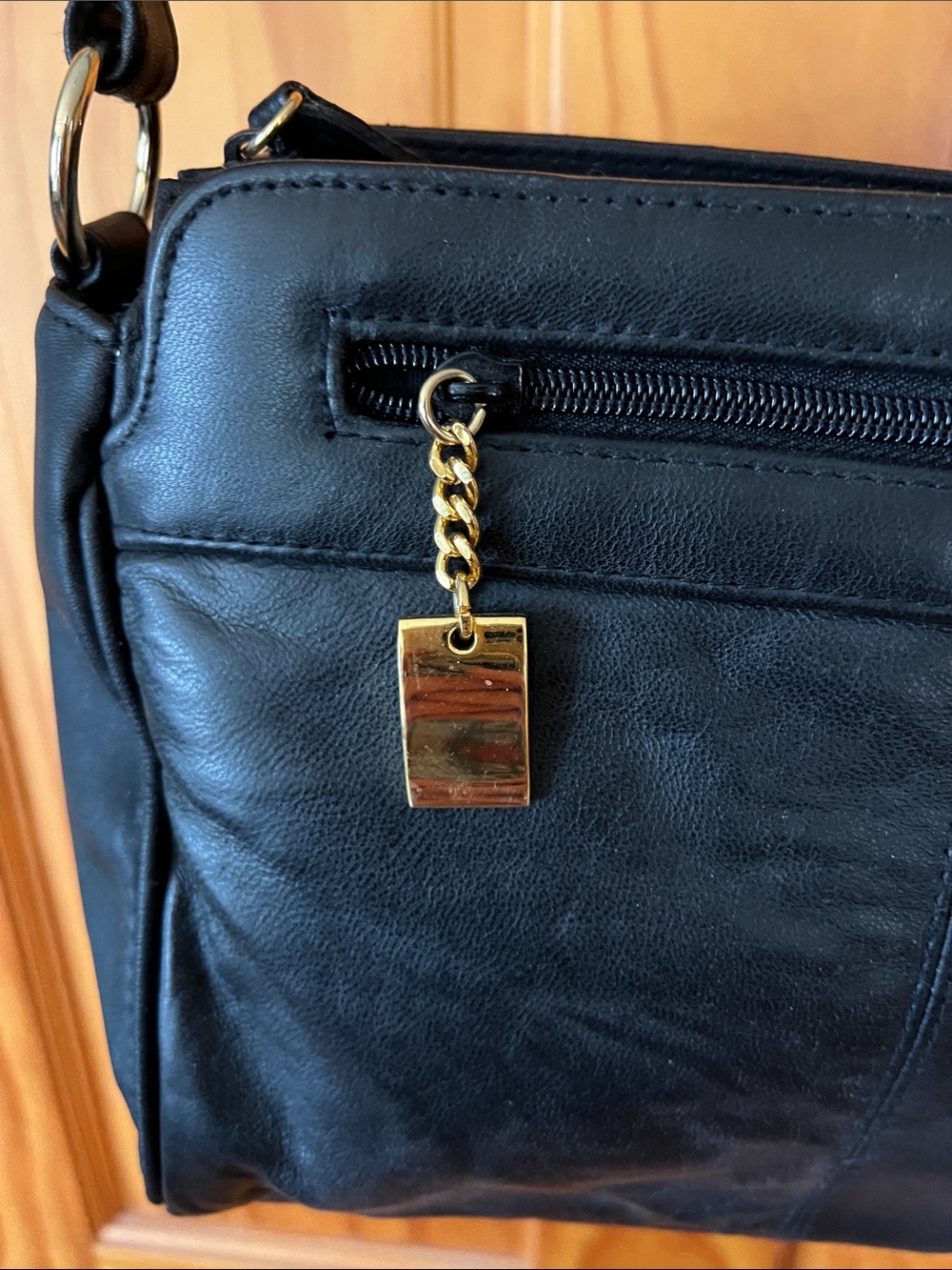Elegant Black Leather Satchel with Gold Accent - Picture 3 of 16